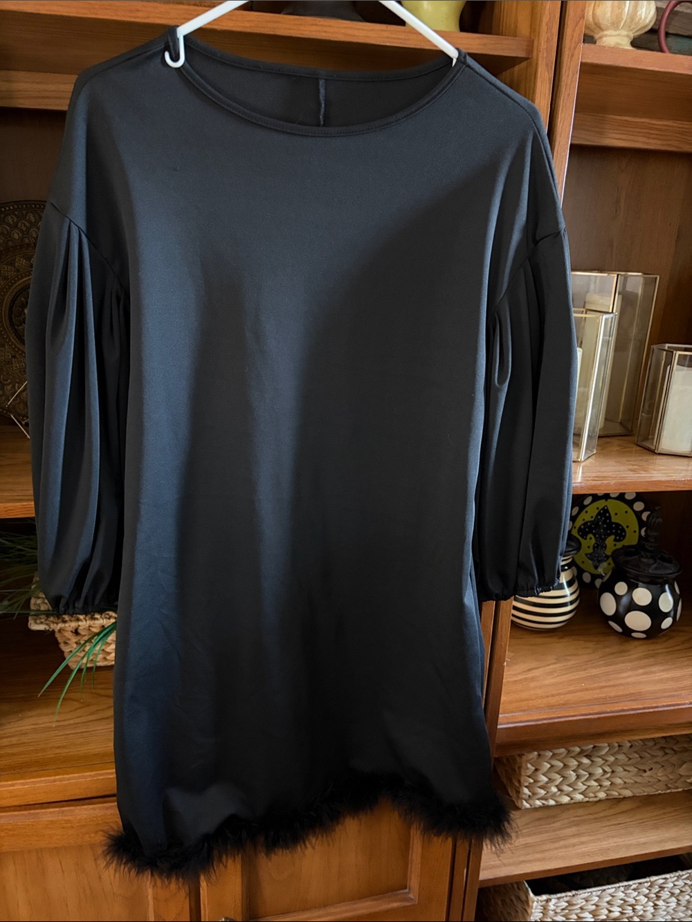 Trendy boutique Black Puff-Sleeve Dress with Feather Hem